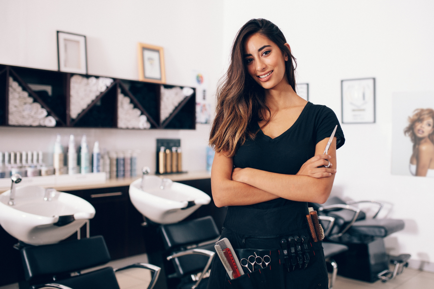 A female hairdresser in black