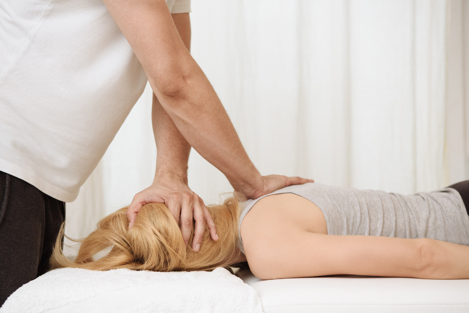 A chiropractor doing an adjustment